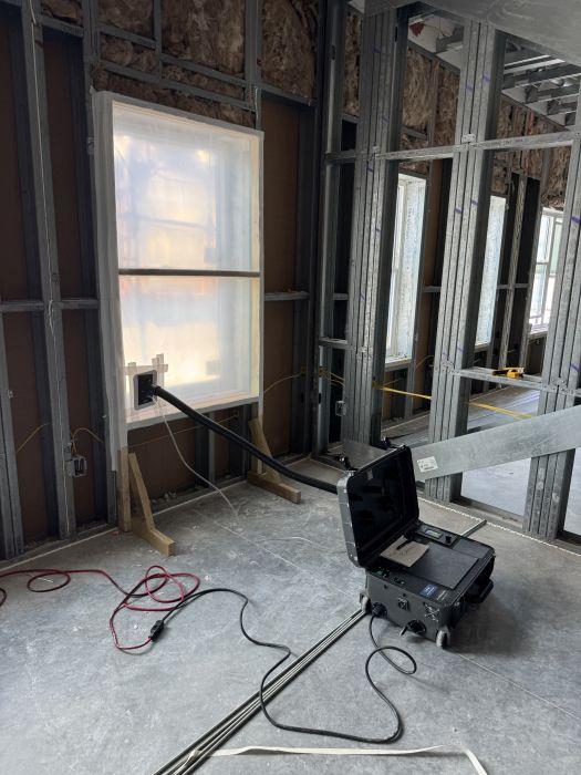 ASTM E783 air infiltration testing of installed window units.